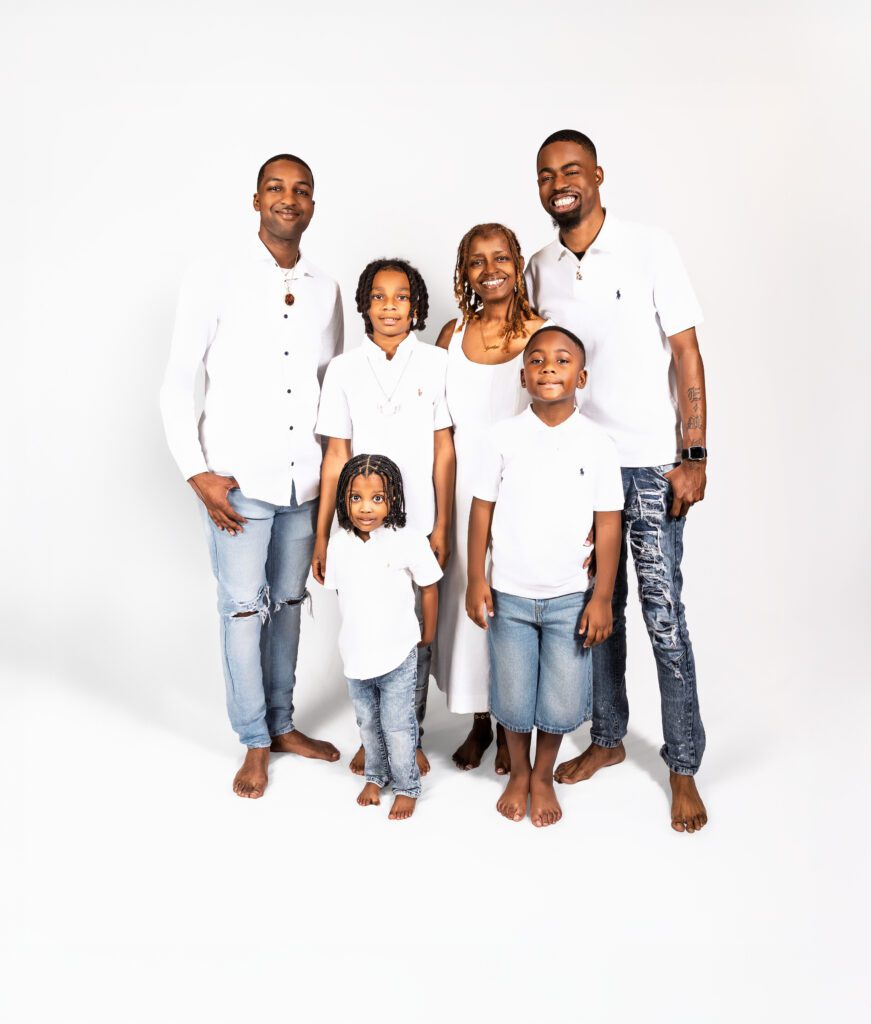 Generational photo of all the men and boys in the family posing together during a family portrait session